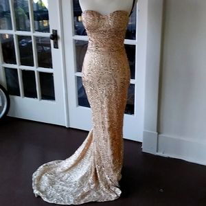 Gold long cocktail dress. Form fitting.